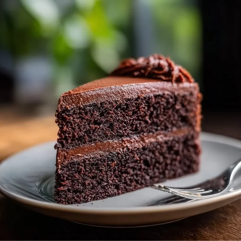 Homemade chocolate cake with rich frosting and decorative sprinkles