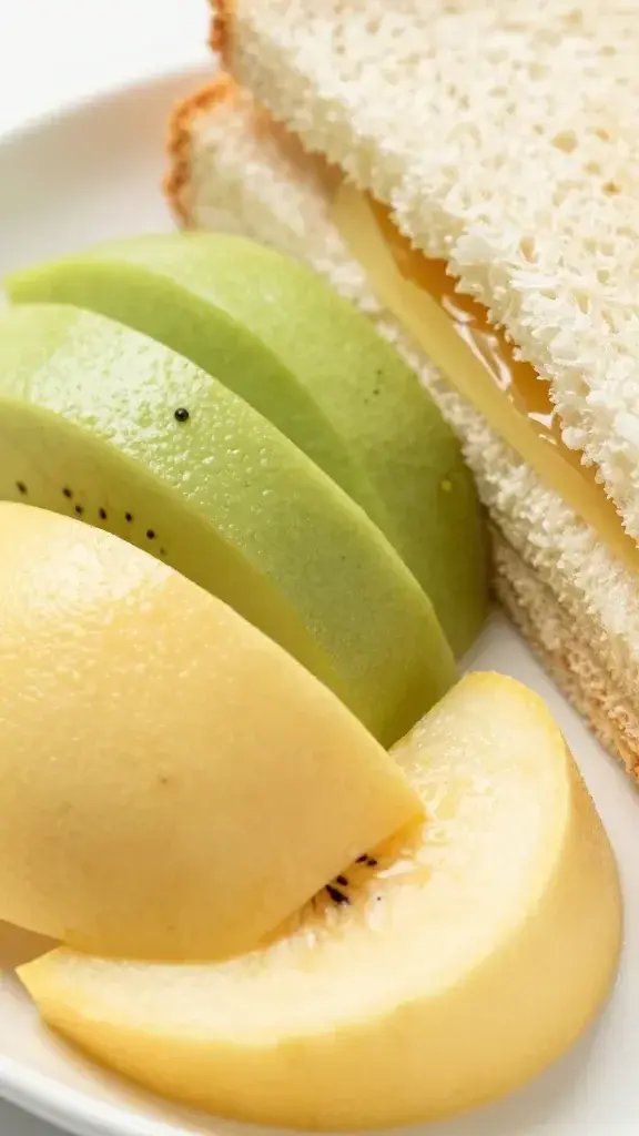 closeup of sliced fruit cluster next to tea sandwich