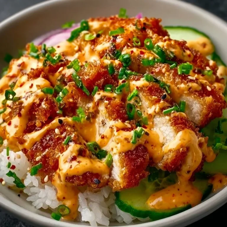 Crispy chicken with creamy spicy sauce served on jasmine rice