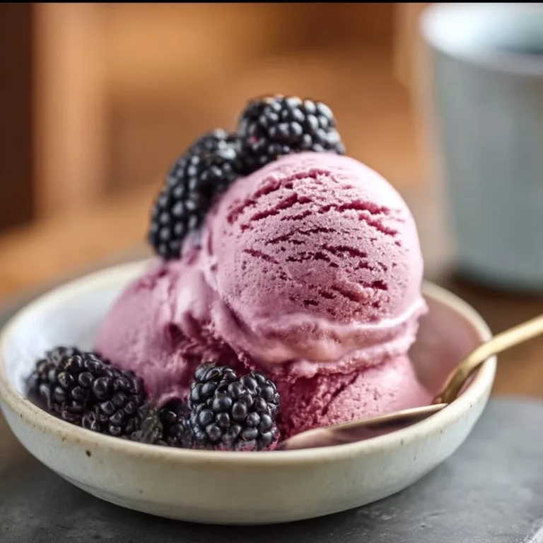 Delicious Ninja Creami blackberry ice cream in a bowl with fresh blackberries
