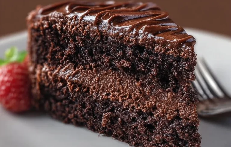 Ultimate Decadent Gluten Free Chocolate Cake served with fresh strawberries