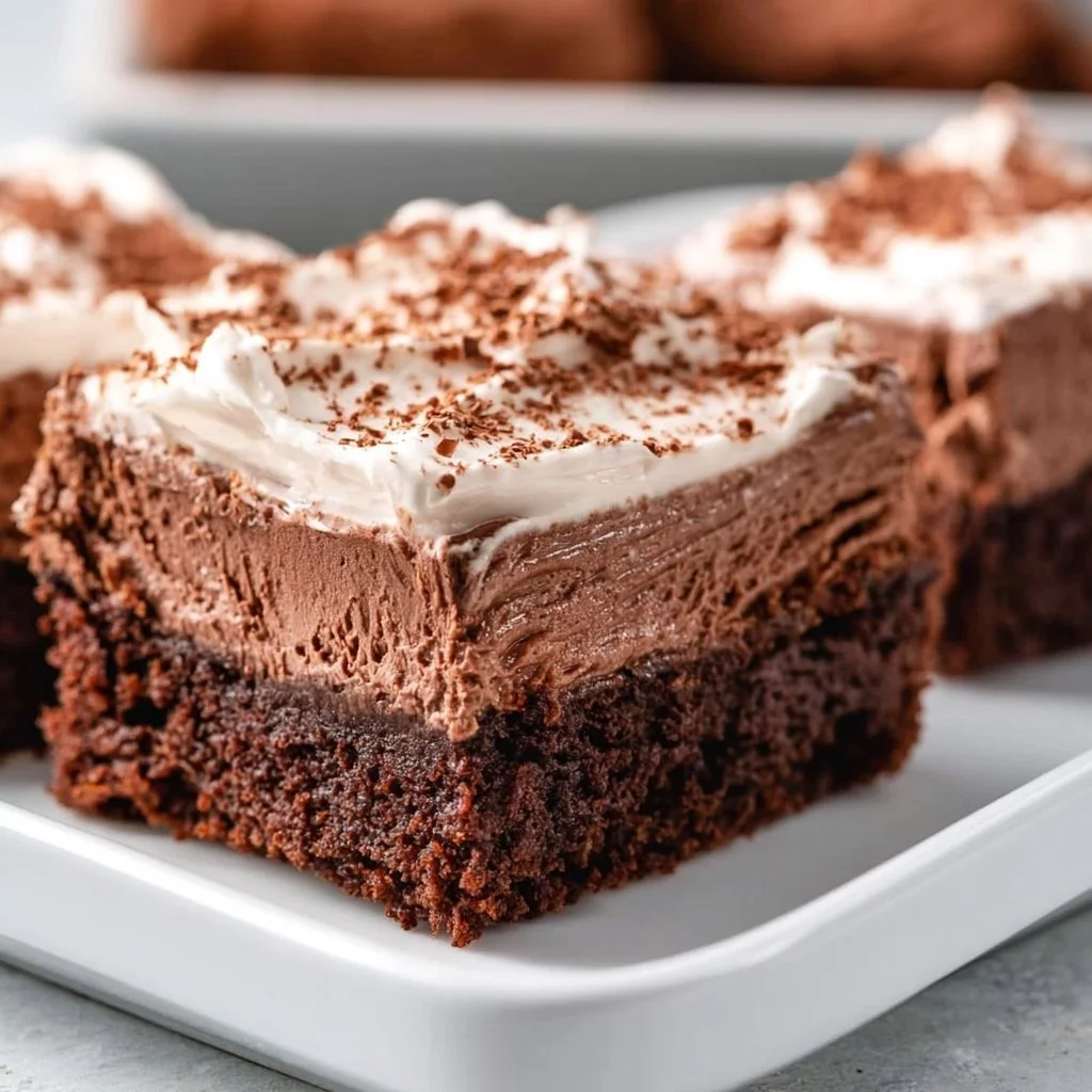 Delicious French Silk Brownies topped with chocolate ganache and whipped cream